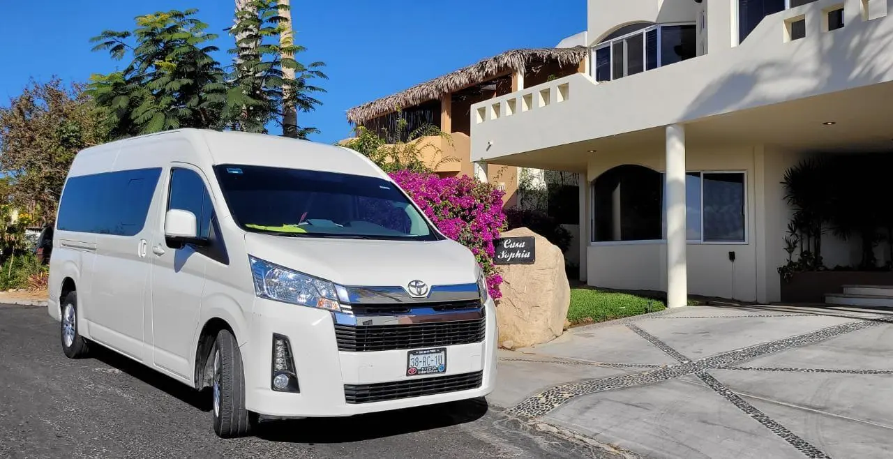 los cabos airport shuttles white van 2024 for large groups parked outside Casa Sophia at cabo san lucas.